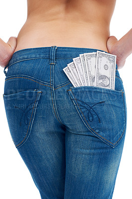 Buy stock photo Finance, savings and cash in jeans of woman for investment and success in studio. Money, dollar and budget with pocket of girl isolated on white background for financial, payment and deal promotion