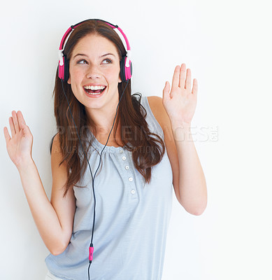 Buy stock photo Music headphones, dance and happy woman listening to fun dancing song, wellness audio podcast or radio sound. Studio dancer, excited energy girl and model streaming edm isolated on white background