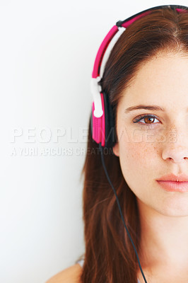 Buy stock photo Music headphones, half face and woman portrait listening to calm girl song, wellness audio podcast or radio sound. Studio, freedom or gen z model streaming relax playlist isolated on white background
