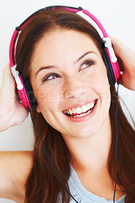 Buy stock photo Music headphones, face and happy woman listening to fun girl song, wellness audio podcast or radio sound. Studio smile, freedom and gen z model streaming edm playlist isolated on white background