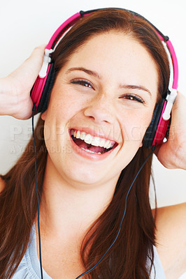 Buy stock photo Music headphones, face and woman portrait listening to fun girl song, wellness audio podcast or radio sound. Studio smile, freedom and happy model streaming edm playlist isolated on white background
