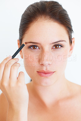 Buy stock photo Makeup, beauty and portrait of woman with eyebrow pencil in studio for shape or grooming on white background. Face, brow and girl model with microblading tool for drawing, filling or product isolated