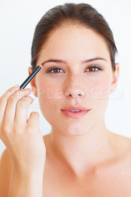 Buy stock photo Beauty, makeup and portrait of woman with eyebrow pencil in studio for shape or grooming on white background. Face, brow and girl model with microblading tool for drawing, filling or product isolated