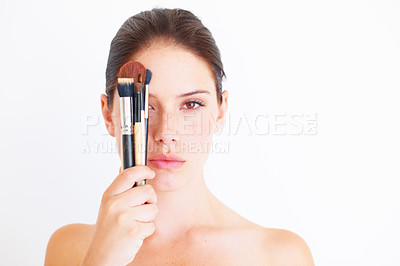 Buy stock photo Woman, face and brush for makeup in portrait, beauty and cosmetics isolated on white background. Mockup space, female in studio with cosmetic tools in hand and skincare, dermatology glow and wellness