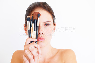 Buy stock photo Woman, face and makeup tools in portrait, beauty and cosmetics isolated on white background. Mockup space, female in studio with cosmetic brush in hands and skincare, dermatology glow and wellness