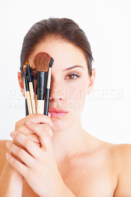 Buy stock photo Woman, face and makeup brush in hands, portrait and beauty with cosmetics isolated on white background. Cosmetology, female in studio with cosmetic tools and skincare, dermatology glow and wellness