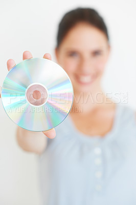 Buy stock photo Vintage, music and hand of woman with cd in studio showing nostalgic, fun and old fashioned entertainment with mockup. Hands, dvd and girl presenting shiny disc, copy space and isolated mock up