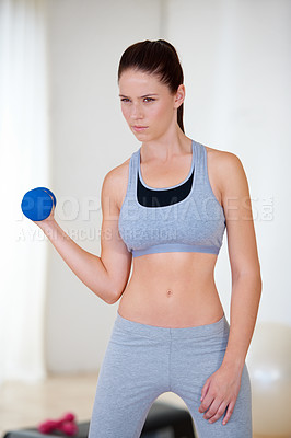 Buy stock photo Woman, serious and thinking with dumbbells in studio for health wellness, fitness and weight loss with cardio exercise. Young person, commitment and power with hand weights for strong muscle in gym