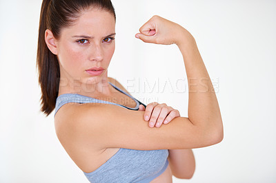 Buy stock photo Woman, portrait or serious in studio with flex for fitness, wellness or workout strength and sportswear. Person, athlete or pride for biceps, exercise or training on white background or mock up space