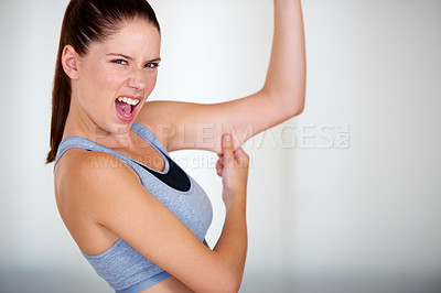 Buy stock photo Fitness, arm and woman holding her fat for health, wellness and weight loss goals in a studio. Shout, scream and portrait of young female person showing bicep body for exercise or workout motivation