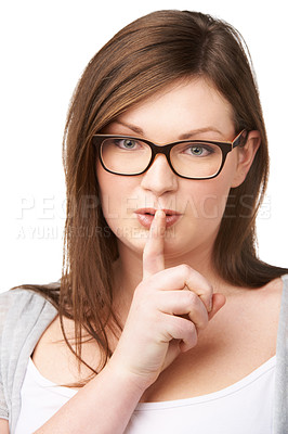 Buy stock photo Studio portrait and plus size model with secret for hush, gossip and privacy news with mystery by white background. Woman, face and emoji for shush with glasses, confidential and silence for noise