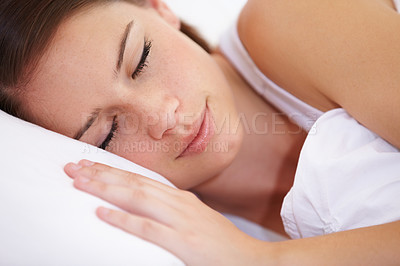 Buy stock photo Sleep, face and woman in a bed with peace, comfort and resting in her home on the weekend. Calm, dreaming and female person sleeping in a bedroom for vacation, day off or peaceful nap in her house