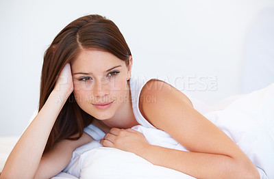 Buy stock photo Smile, thinking and woman relaxing on bed for resting with positive, good and confident attitude. Happy, calm and young female person from Canada laying and chilling in bedroom of modern apartment.