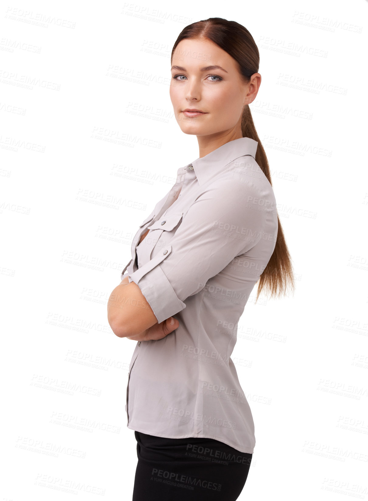 Buy stock photo Cropped shot of an attractive young woman standing with her arms folded isolated on white
