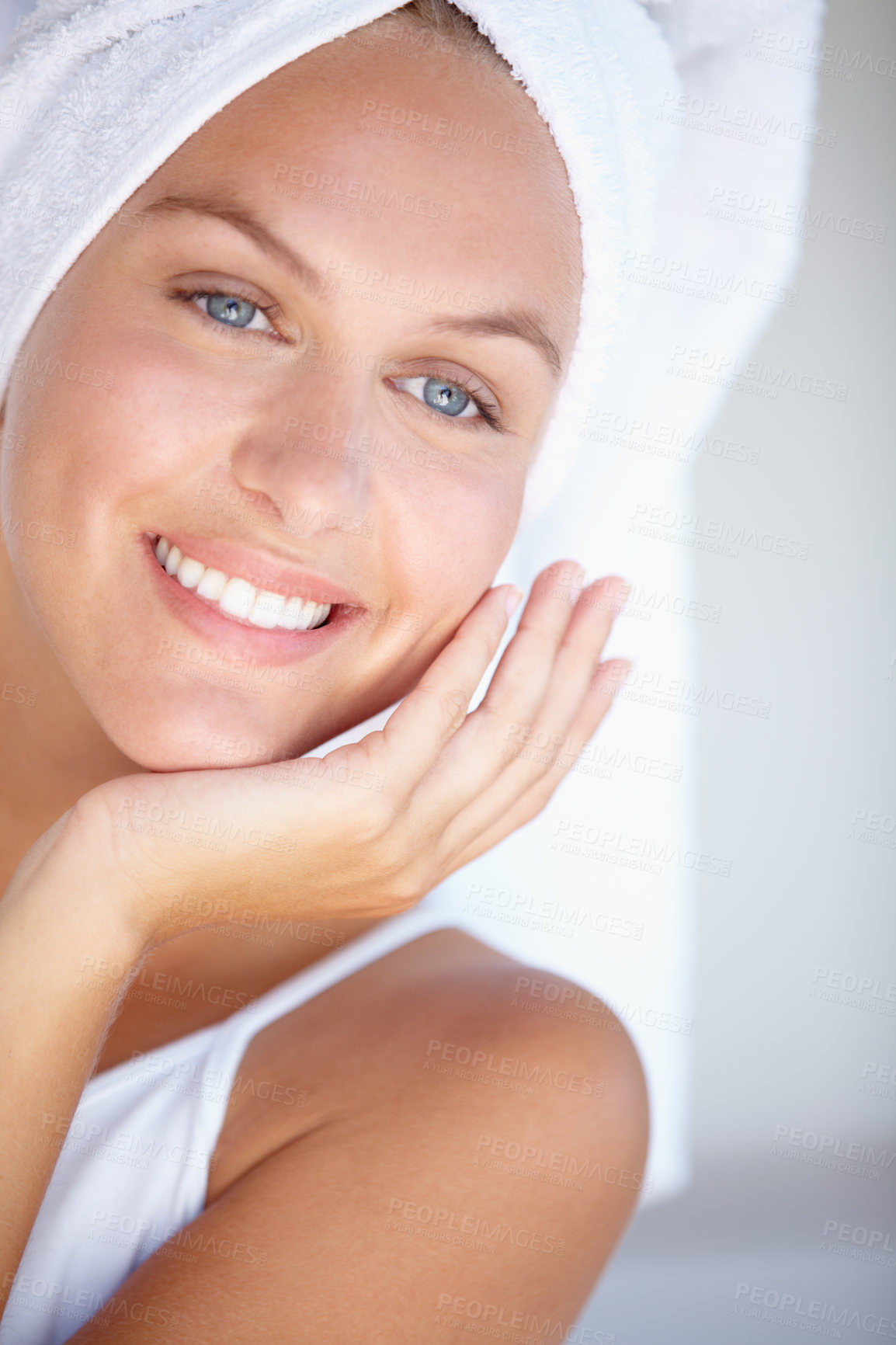 Buy stock photo Face of happy woman, thinking or towel for skincare or wellness in bathroom for glow or detox. Morning, clean or confident lady with dermatology results, beauty or healthy skin with smile in home
