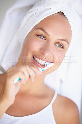Buy stock photo Shot of a beautiful woman brushing her teeth