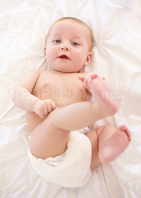 Buy stock photo Baby feet on bed in top view, portrait and young child development, innocent and relax at home. Face of kid, infant foot above and toes in nursery to rest, bedroom and healthy body, cute or adorable