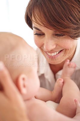 Buy stock photo Mother, baby and happiness or love, smile and relaxing or care, bonding and joy in parenthood. Mom, newborn and peace or calm at home, positive and happy for child development, joy and fun together