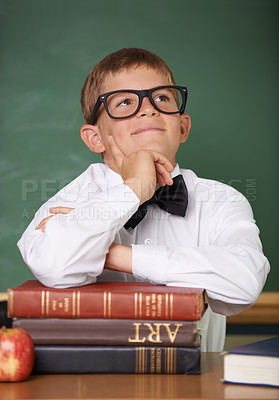 Buy stock photo Boy child, books and school with thinking, ideas or information for knowledge, solution and classroom. Student kid, problem solving and brainstorming for education, learning or development with books