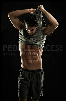 Buy stock photo Off, black background or shirt of man with six pack, strong abs or stomach in studio for fitness. Model, cool guy or ripped male person with healthy body, dark shadow or abdomen muscle for wellness