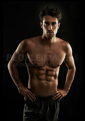 Buy stock photo Confident, black background or portrait of man with six pack, strong abs or stomach in studio for fitness. Cool, model or ripped person with healthy body, dark shadow or abdomen muscle for wellness