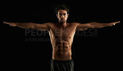 Buy stock photo Handsome topless man raising his arms to his side - Isolated on black