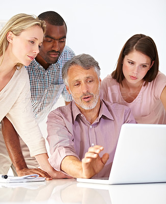 Buy stock photo Business people, collaboration and teamwork on laptop for graphic design planning, manager feedback and advice. Group meeting, mature boss and creative designer team on computer and software training