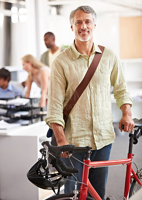 Buy stock photo Mature, businessman and bicycle in office with portrait and manager of sustainable company. Ceo, boss and job with eco friendly commute in morning with smile in a creative agency of a professional 