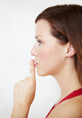 Buy stock photo Secret, hand and woman with finger on lips in studio for gossip, privacy or sign on white background. Whisper, profile and female person with silence, confidential or emoji with drama or announcement