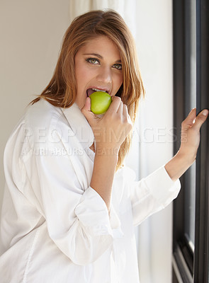 Buy stock photo Breakfast, apple and portrait of woman in home for healthy eating, nutrition and detox diet. Bite, morning and person with fruit, meal and snack for wellness, organic and natural vitamins in house