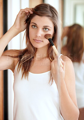 Buy stock photo Mirror, makeup and face of woman in bathroom for morning skincare routine, dermatology and beauty. Getting ready, reflection and girl with brush for foundation, cosmetics and skin care glow in home.