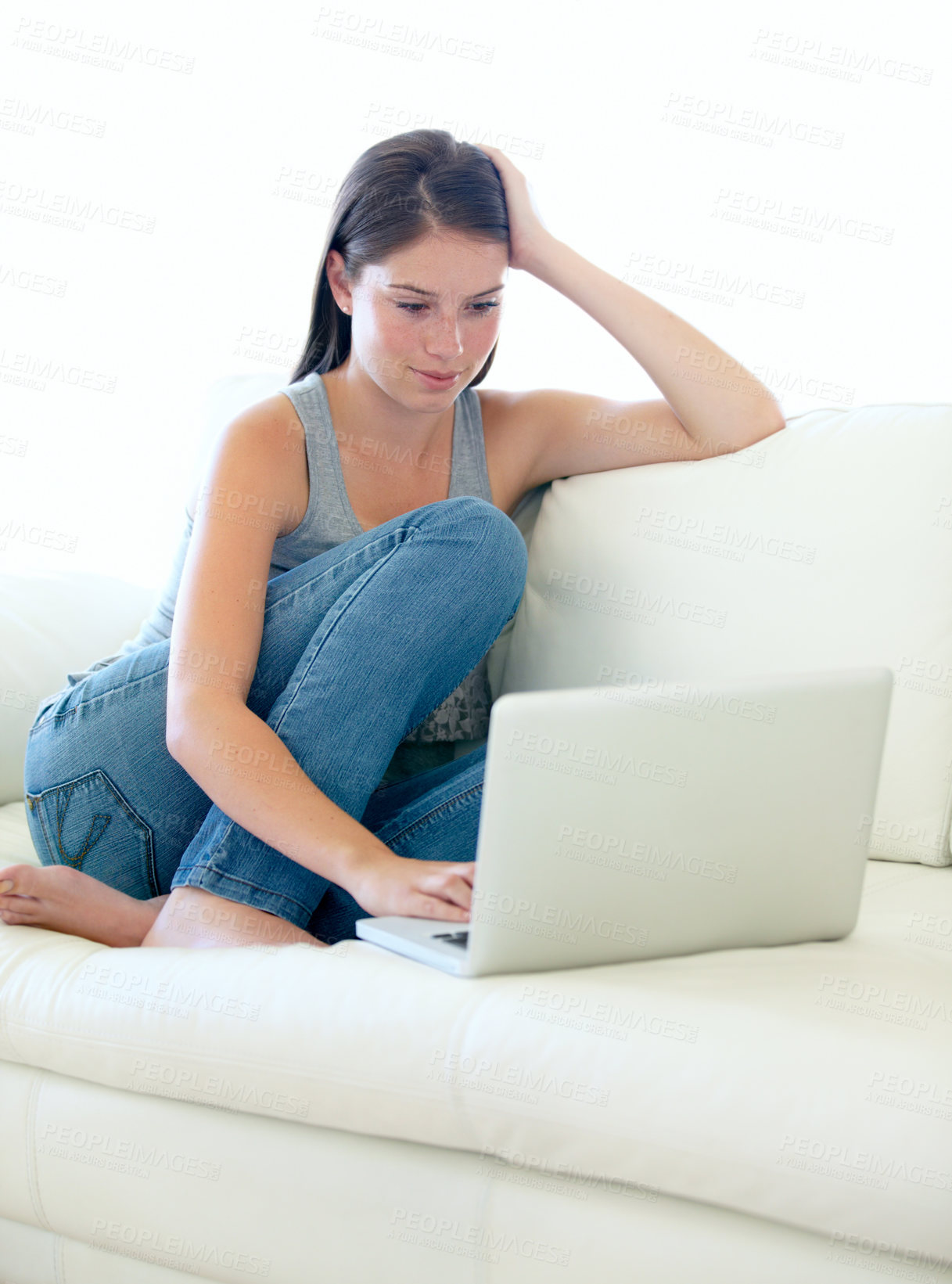 Buy stock photo Sofa, laptop and woman or student for internet, online education or search for sign up information on website. Young person relax on couch and typing on computer for subscription or streaming at home