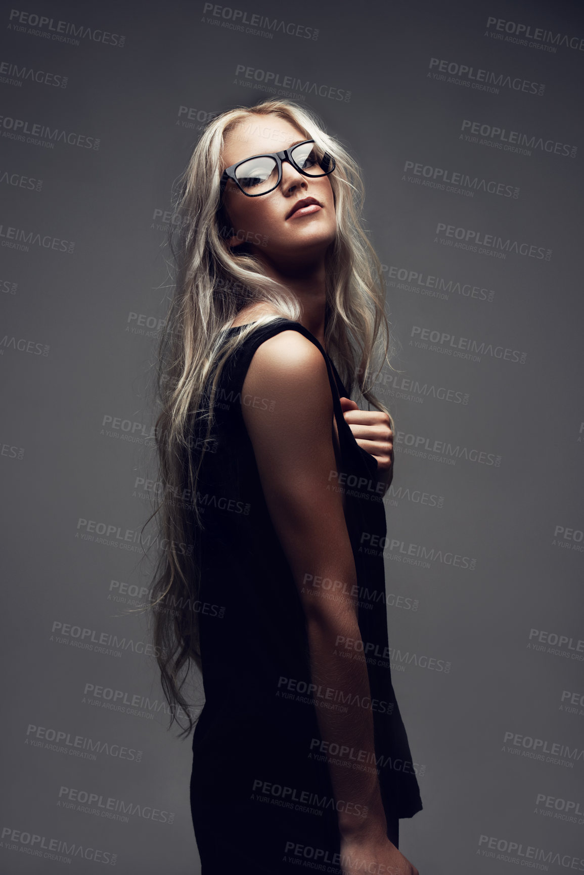 Buy stock photo Portrait, woman and glasses in studio with fashion, style and trendy prescription with positive by gray background. Model, confident and eyecare on face with wellness, blonde and elegant aesthetic