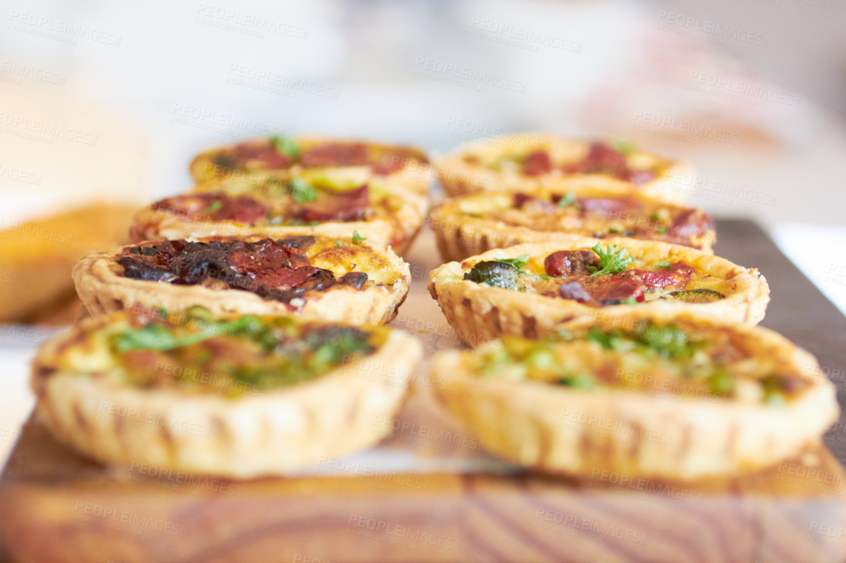 Buy stock photo Cropped shot of a fresh batch of mini quiches