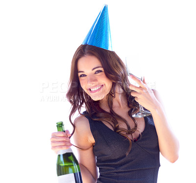 Buy stock photo Portrait of an attractive young woman wearing a party hat and holding a bottle