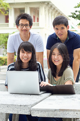 Buy stock photo Smile, portrait and students with a laptop for education, studying and college research. Happy, Asian and men and women with a computer and notes for university work, learning and a group project