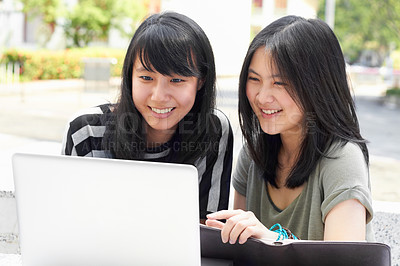 Buy stock photo Smile, education and students with a laptop on campus for research, studying and project together. College, Asian and women reading an email on a computer, learning and happy with university work