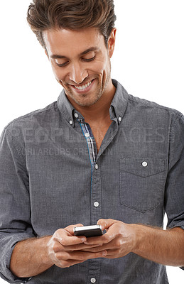 Buy stock photo A handsome young man sending a text message