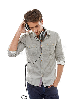 Buy stock photo Man, headphones and music in studio for audio subscription, streaming multimedia and radio on white background. Cool guy listening to podcast, hearing sound and relax for song, entertainment or album