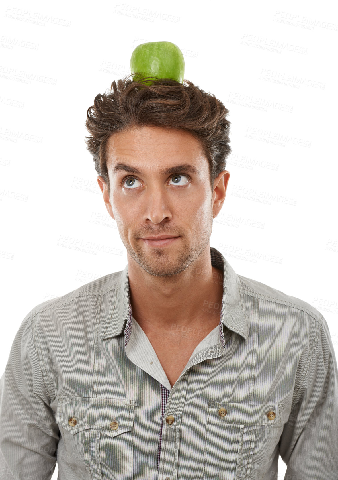 Buy stock photo Balance, man and apple on head, thinking of food and healthy diet isolated on a white background in studio. Idea, person or green fruit for nutrition, vegan or wellness benefits, vitamin c or organic
