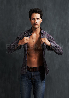 Buy stock photo Handsome, fashion and portrait of man by a wall with trendy, cool and stylish outfit with confidence. Abs, attractive and young male model from Canada with casual shirt and jeans by gray background.