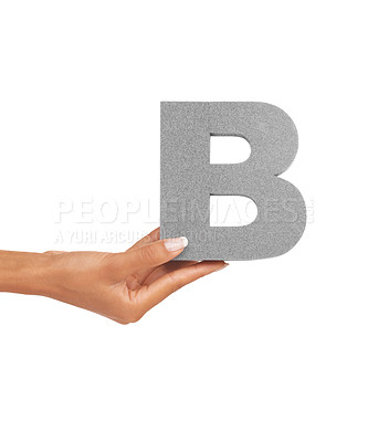 Buy stock photo Hand of woman, capital letter B and presentation of consonant isolated on white background. Character, font and palm with English alphabet typeface for communication, reading and writing in studio.
