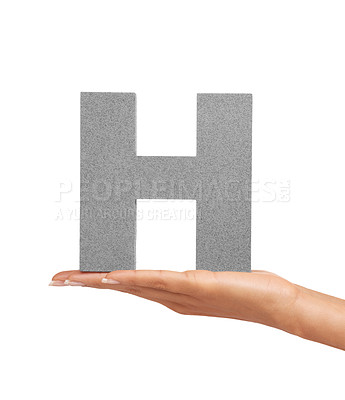 Buy stock photo Hand of woman, font letter H and presentation of consonant isolated on white background. Character, uppercase and palm with English alphabet typeface for communication, reading and writing in studio.