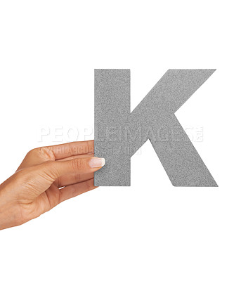 Buy stock photo Hand of woman, font letter K and presentation of consonant isolated on white background. Character, uppercase and person with English alphabet typeface in communication, reading and writing in studio