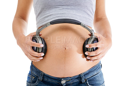 Buy stock photo Pregnant woman, headphones on stomach and music for zen baby meditation, relax wellness and streaming podcast or radio for child. Pregnancy, belly and audio sound on abdomen for baby calm peace 