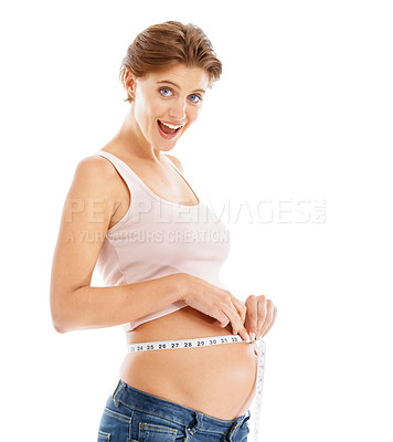 Buy stock photo Portrait of happy pregnant woman with measuring tape on stomach, excited smile on face and white background. Health, wellness and pregnancy, woman measuring growth progress of baby in belly in studio