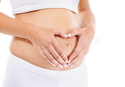 Buy stock photo Pregnant woman, hands and heart shape in studio for baby, love and security support in white background studio. Pregnancy wellness, maternity and hand frame abdomen for infant healthcare or growth
