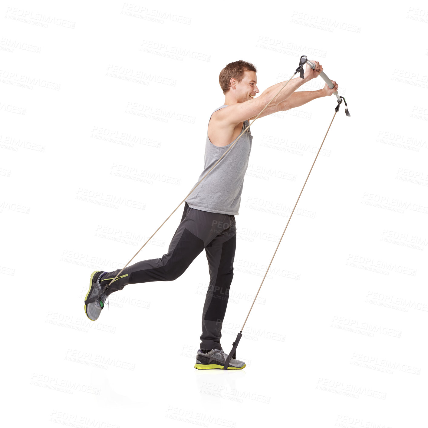 Buy stock photo Fitness, gym and resistance band with a young man in studio isolated on a white background for health. Workout, exercise or performance and a strong athlete training with equipment for wellness