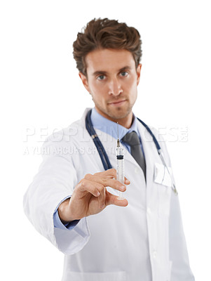 Buy stock photo Studio portrait of a serious-looking young doctor holding a syringe