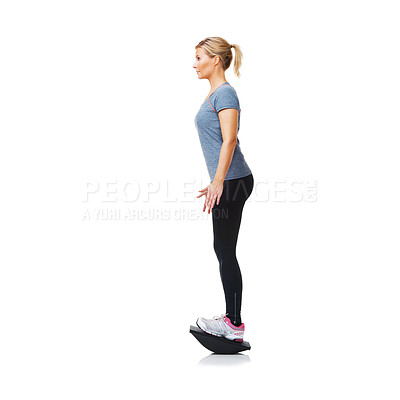 Buy stock photo Balance board, workout and woman with exercise, wellness and girl isolated on a white studio background. Profile, person and model with equipment, mockup space and healthy with training and fitness